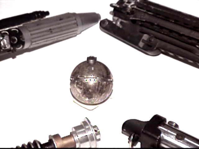 Various prop weapons. Centre: thermal detonator. Bottom left: Kenobi or Luke 